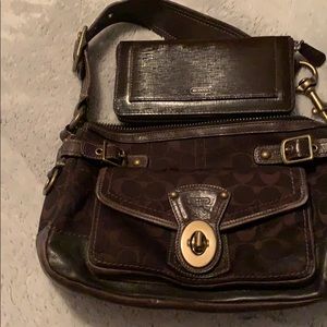 A brown coach bag with a brown wallet, used
